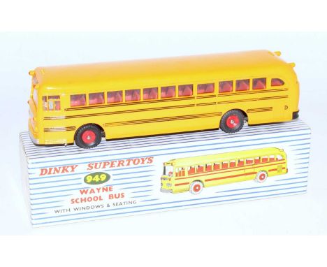 A Dinky Toys No. 949 Waynes School bus comprising yellow body with red interior and red plastic hubs house din the original b