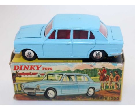 A Dinky Toys No. 162 Triumph 1300 saloon comprising light blue body with red interior and spun hubs with opening boot and bon