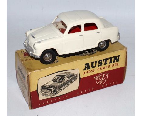 A Victory Models boxed 1/18 scale plastic and battery operated model of an Austin A40/50 Cambridge saloon comprising of cream