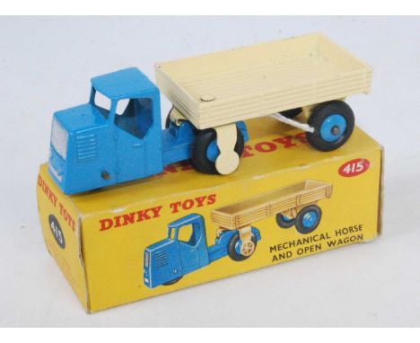 A Dinky Toys No. 415 mechanical horse and open wagon, comprising of blue tractor unit and cream trailer both fitted with ligh