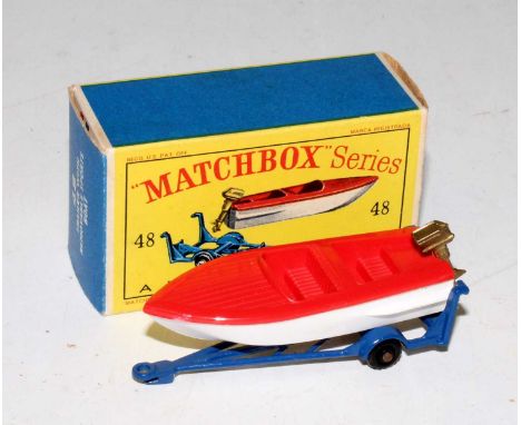 A Matchbox No. 48 trailer with removable sports boat comprising of dark blue trailer with black plastic wheels, red and white