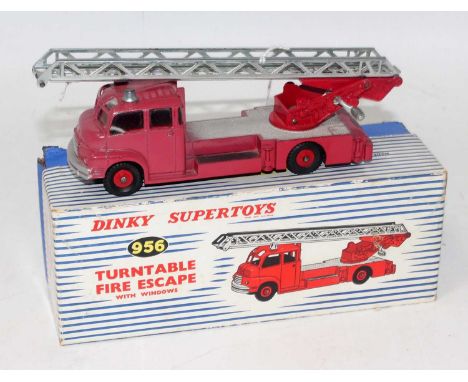 A Dinky Toys No. 956 turntable fire escape comprising of red body with red plastic hubs and silver ladder, model is heavily f