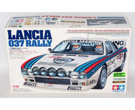 A Tamiya model No. 58278 1/10 scale boxed model of a Lancia 037 Rally car, suitable for radio controlled use, unmade example,