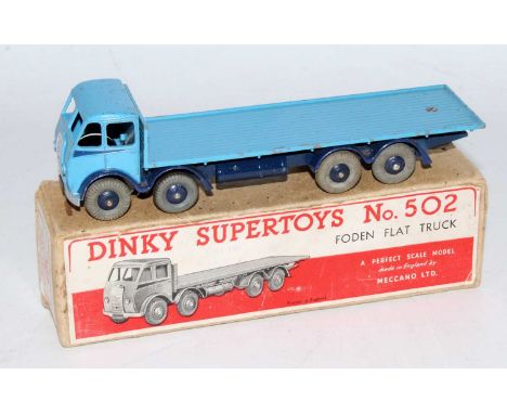 A Dinky Toys No. 502 Foden flat truck comprising of first type cab with light blue cab, dark blue chassis and light blue back