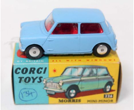 A Corgi Toys No. 226 Morris Mini Minor comprising of light blue body with red interior and spun hubs housed in the original b