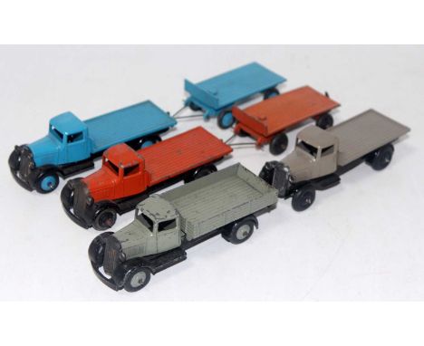 Six various loose Dinky Toy early series commercial vehicles to include 25E tipping wagon finished in grey, together with thr