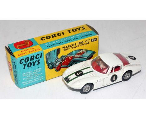 A Corgi Toys No. 324 Marcos 1800 GT comprising of red body with red interior and racing No. 4 with wire work hubs, housed in 