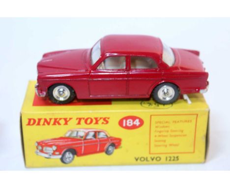 A Dinky Toys No. 184 Volvo 122S comprising of red body with cream interior and spun hubs, housed in the original picture side