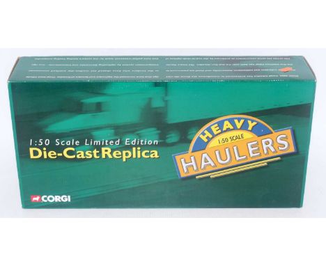 A Corgi Heavy Haulers limited edition 1/50 scale tractor unit, trailer and load model, model No. US55705 comprising of a Kenw