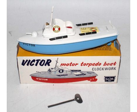 A Sutcliffe Models tinplate and clockwork model of a Victor Motor Torpedo speed boat, appears complete and comprising of blue