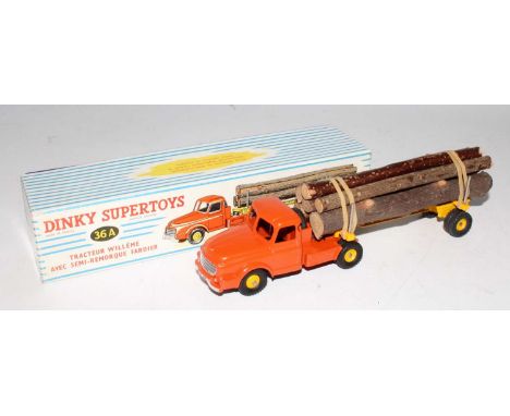 A French Dinky Toys No. 36A Willeme tractor unit and log trailer, comprising of orange to red tractor unit with yellow hubs, 