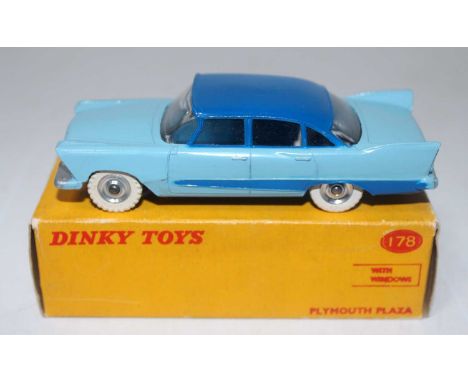 A Dinky Toys No. 178 Plymouth Plaza with windows comprising of two-tone light blue and dark blue body with spun hubs and whit