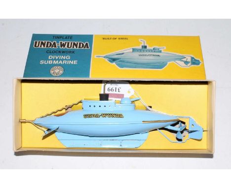 A Sutcliffe Models tinplate and clockwork model of an Unda-Wunda clockwork diving submarine comprising of blue body with bung