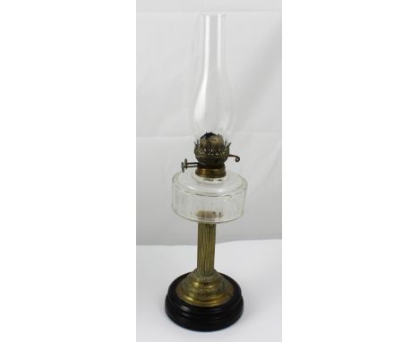 An early 20th century brass column oil lamp on circular stepped base, height 63cm.