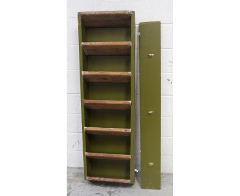 An early 20th century ladder, green painted and converted to a wall-hanging coat rack, length 143cm.