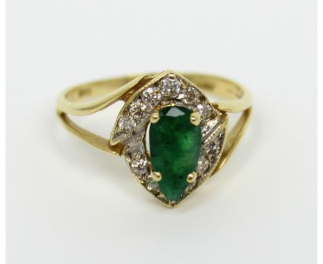 A 14ct gold dress ring set with central pear shaped emerald coloured stone and small diamond surround, size O, approx 2.5g.