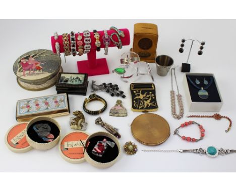 A quantity of costume jewellery to include Chanel-style bracelets, Cartier-style bracelets, various brooches, vintage compact