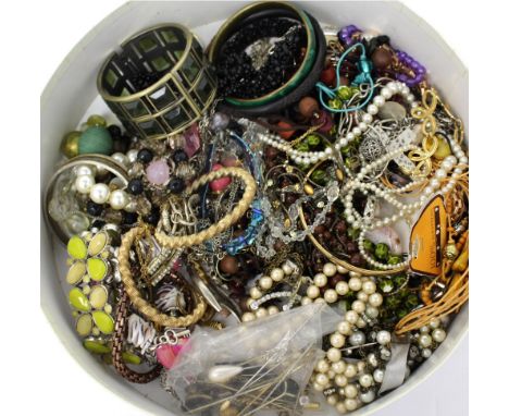 A small box of vintage costume jewellery to include necklaces, bracelets, bangles, and various assorted tie pins.