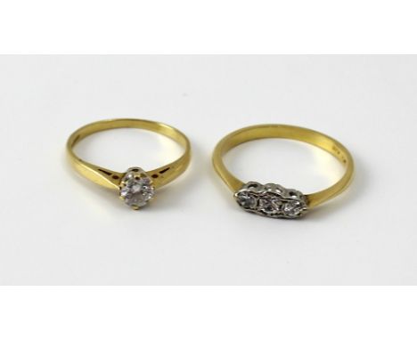 An 18ct yellow gold and diamond solitaire ring, the round brilliant cut stone approx 0.2ct, size K, and an 18ct yellow gold a