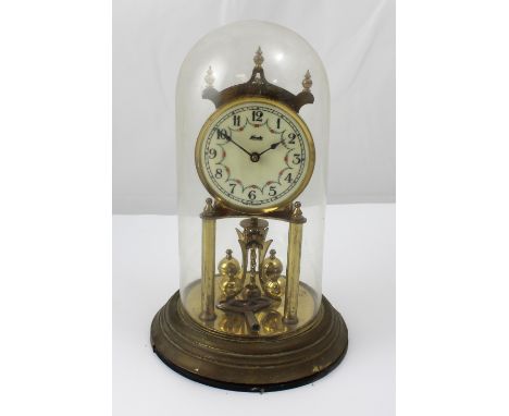 A Kundo Kiennger and Obergfell anniversary clock, white ceramic dial set with Arabic numerals and floral-decorated, height 24