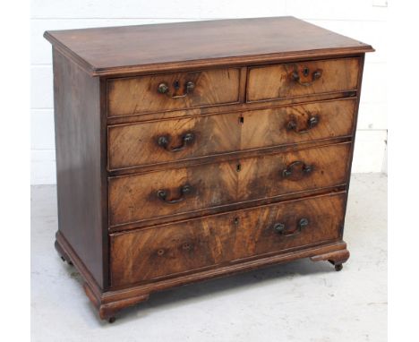 A Victorian mahogany chest of two-over-three drawers, drawer fronts decorated in book-matched curl mahogany veneer to oak car