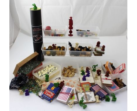 A mixed lot of gaming items to include chess pieces, tiddlywinks, playing cards, plastic Dungeons & Dragons tabletop figures,