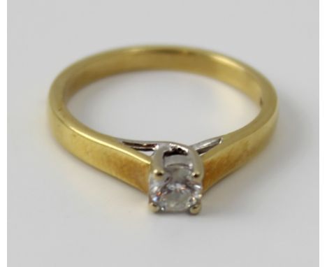 An 18ct Yellow gold and diamond solitaire ring, the round brilliant cut stone approx 0.2ct, size K, approx 2.9g.