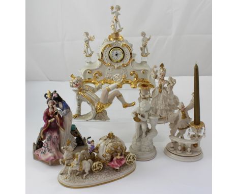 A collection of seven white ceramic and gilded items to include an ornamental clock, figurines etc.