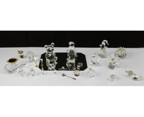 A quantity of Swarovski to include geese, elephants, a small cake, Champagne bottle, hedgehog, stick pin etc.