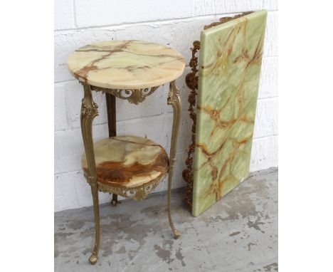 An onyx circular side table with lower shelf on gilt metal tapering supports, height 76cm and an onyx-effect wall-mounted she