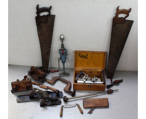 A quantity of vintage tools to include saws, bit and braces, planes, rebate planes, an American pump-action screwdriver, a sh