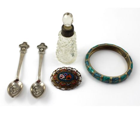 A gilt metal framed micromosaic brooch, a white metal and enamel bangle, a glass scent bottle with hallmarked silver rim and 