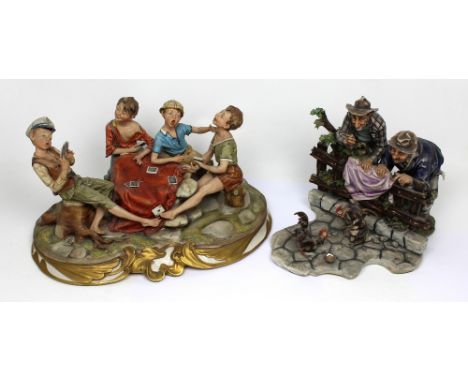 Two Capodimonte figure groups; young boys playing cards and two elderly gentlemen watching cockerel fighting (2). CONDITION R