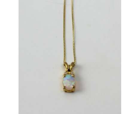 A 9ct gold opal pendant on a 9ct gold fine link chain, approx 7g.