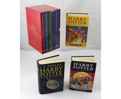 J K Rowling; a boxed set of four books, 'Harry Potter and the Philosopher's Stone', 'Harry Potter and the Chamber of Secrets'