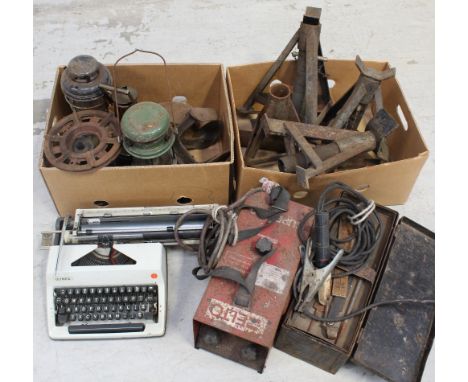 A quantity of vintage oil lamps, a single ring burner, shoe lasts, vintage car jacks, a metal tool box containing a small qua