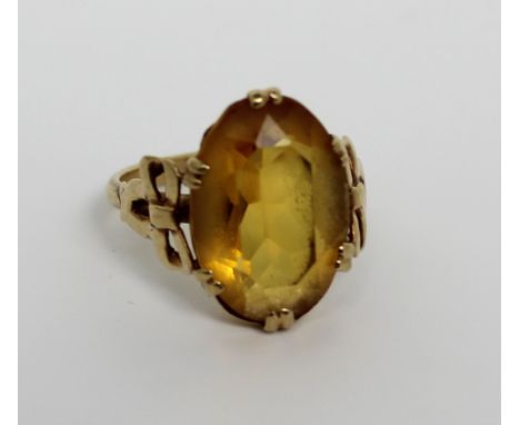 A 9ct gold ladies' dress ring set with oval citrine, size J, approx 3.1g.