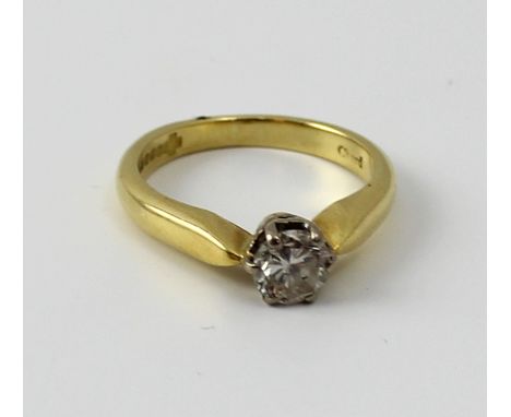 An 18ct yellow gold and diamond solitaire ring, set with round brilliant-cut stone, size I, approx 3.6g.