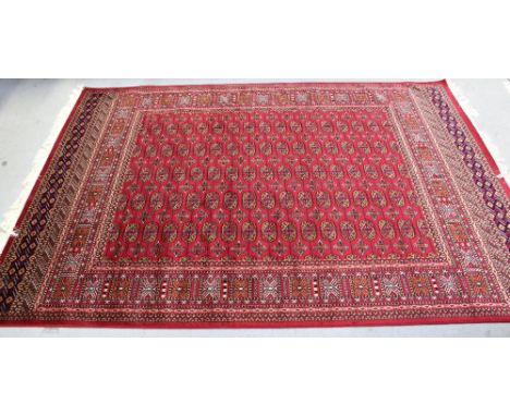 A modern red ground Bokhara carpet, 230 x 160cm.
