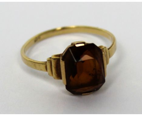 A 9ct gold Art Deco style ring with amber coloured stone, size N, approx 2g.