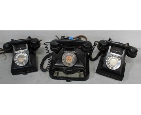 Three vintage black Bakelite telephones from a call exchange to include two examples with notepad drawers, serial nos. 312LTE