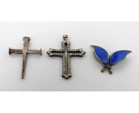 A Continental paste-set white metal cross pendant, a silver cross in the form of three nails, marked '925' and a Norwegian bl