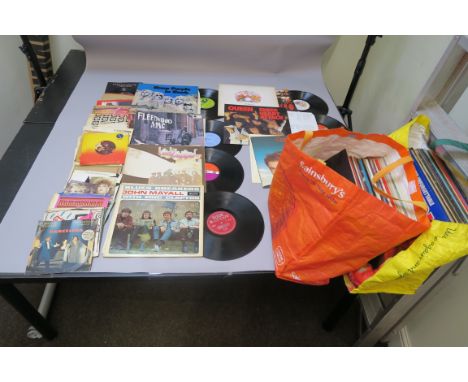 LP vinyl records in two large bags plus a small quantity of 7 inch singles LPs include John Mayall Bluesbreakers LK 4804 unbo