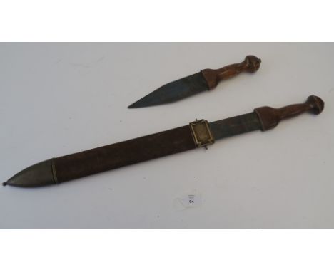 "Gladiator" (2000) directed by Ridley Scott and starring Russell Crowe movie prop metal Roman sword with wooden handle and su