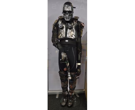 Terminator inspired exo-skeleton custom built 6 ft model. Equipped with fogger and light up red LED eyes in skull. The base i