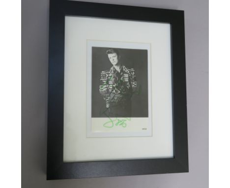 David Bowie hand signed Walker print of London photo signed "To Nigel David Bowie" dated 1985 in green felt pen on black and 