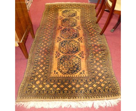 A Persian woollen rust ground Bokhara rug, having flatweave ends, 225 x 115cmColours are patchy.One repair to middle of rug.L