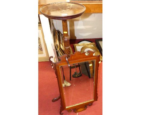 An early 20th century mahogany spiral turned fixed top plant stand, raised on acanthus leaf carved hipped supports, h.114.5cm
