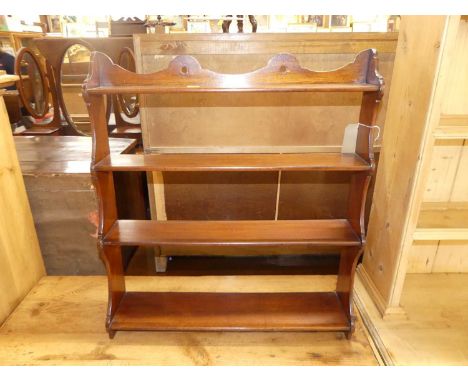 A circa 1900 mahogany waterfall four-tier wall shelf, width 61.5cm