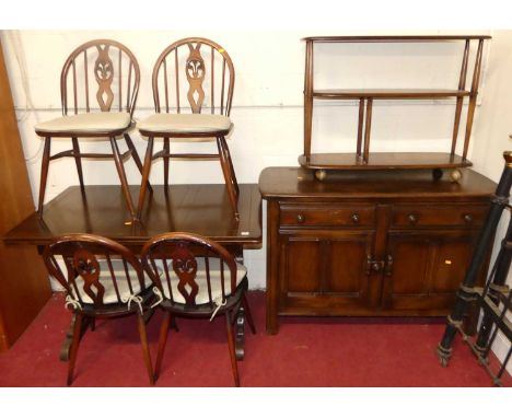 Dark Ercol dining furniture, to include; a trestle end drawleaf table, four chairs, sideboard, and a wheeled three-tier troll